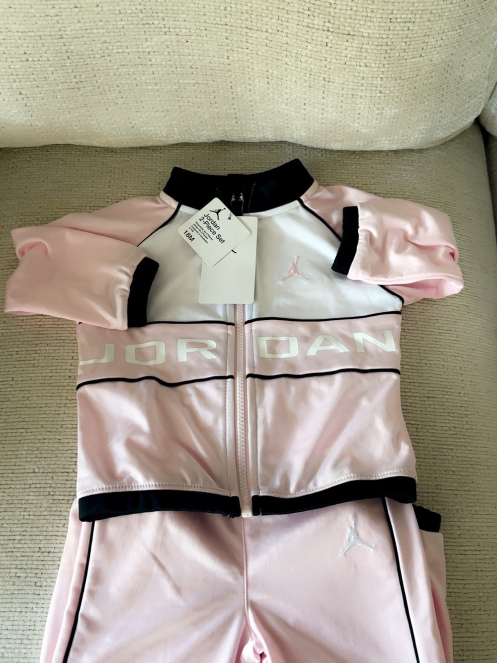 Jordan Pink and Black Kids' One-Piece Zippered Bodysuit with White Accents